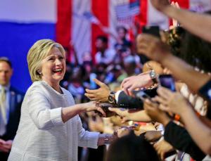 Democratic presidential candidate Hillary Clinton greets supporters as she arrives to speak during a presidential primary election night rally, Tuesday, June 7, 2016, in New York. (AP Photo/Julie Jacobson)