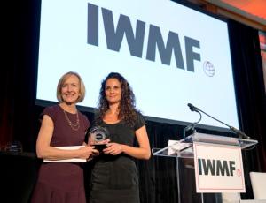 Judy Woodruff, left, presents Kenya-based freelance photographer Adriane Ohanesian with the Anja Niedringhaus Courage in Photojournalism Award, Thursday, June 9, 2016 in Washington. The annual award was first given in 2015. It goes to a female photographer whose life and work honor Niedringhaus' legacy. (AP Photo/Alex Brandon)