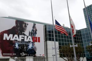 Flags outside the Electronic Entertainment Expo in Los Angeles, fly at half-staff on Monday, June 13, 2016 in honor of the victims of the gay nightclub attack in Orlando. E3 kicked off Sunday and Monday with flashy presentations featuring footage of upcoming games, many of which depict unrelenting gun violence, from Electronic Arts, Bethesda Softworks, Microsoft and Ubisoft. (AP Photo/Nick Ut)