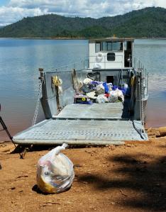 This Tuesday, May 24, 2016 photo provided by the U.S. Forest Service shows bags of trash on a boat after cleaning up a half-mile-wide swath of trash left behind by about 1,000 campers after an annual trip to Lake Shasta, Calif., by fraternity and sorority members. Shasta-Trinity National Forest spokeswoman Phyllis Swanson says it took about 25 workers five hours to clean up the weekend mess on Slaughterhouse Island in Lake Shasta on Tuesday. (U.S. Forest Service via AP)
