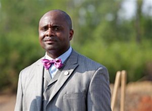In this July 25, 2014 photo Councilman C.J. Small Jr. is pictured during a groundbreaking ceremony held for the McGowin Park Shopping Center near Hank Aaron Stadium in Mobile, Ala. The city council member from Mobile, was hospitalized in stable condition Monday, May 23, 2016 after he was shot in the face while traveling in Johannesburg, South Africa, a family representative said. (Mike Brantley/Alabama Media Group via AP, File)
