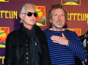 FILE - In this Oct. 9, 2012 file photo, Led Zeppelin guitarist Jimmy Page, left, and singer Robert Plant appear at a press conference ahead of the worldwide theatrical release of "Celebration Day," a concert film of their 2007 London O2 arena reunion show, in New York. Led Zeppelin's lawyers asked a judge Monday, June 20, 2016, to throw out a case accusing the band's songwriters of ripping off a riff for "Stairway to Heaven." (Photo by Evan Agostini/Invision/AP, File)