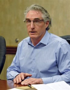FILE - In this May 10, 2016, file photo, North Dakota Republican gubernatorial hopeful Doug Burgum speaks during an editorial board meeting in Bismarck. North Dakota Republicans nominated former Microsoft executive Burgum Tuesday, June 14, 2016, in a primary likely to decide the next governor, and voters also overwhelmingly rejected the Legislatures move to loosen the state's Depression-era rules prohibiting corporate farming. (Tom Stromme/The Bismarck Tribune via AP, File)  MANDATORY CREDIT