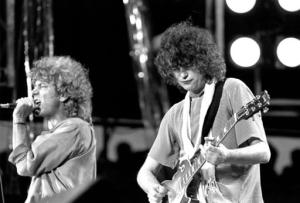 FILE - In this July 13, 1985 file photo, singer Robert Plant, left, and guitarist Jimmy Page of the British rock band Led Zeppelin perform at the Live Aid concert at Philadelphia's J.F.K. Stadium. Generations of aspiring guitarists have tried to copy the riff from Led Zeppelin's “Stairway to Heaven.” Starting Tuesday, June 14, 2016, a Los Angeles court will try to decide whether the members of Led Zeppelin themselves ripped off that riff. Page and Plant are named as defendants in the lawsuit brought by the trustee of late guitarist Randy Wolfe from the band Spirit. (AP Photo/Rusty Kennedy, File)