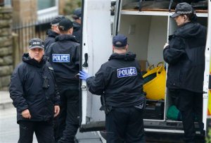 Police continue to search the crime scene in Birstall, West Yorkshire, England Friday, June 17, 2016 the day after Labour MP Jo Cox was murdered in the street outside her constituency advice surgery.  (Danny Lawson/PA via AP) UNITED KINGDOM OUT NO SALES NO ARCHIVE