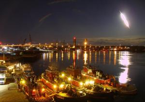 In this frame from video provided by portsmouthwebcam.com, a fireball streaks across the sky at Portsmouth Harbor early Tuesday, May 17, 2016, in Portsmouth, N.H. The bright flash visible from several states was apparently left by a meteor burning up as it passed through Earth's atmosphere. (Mike McCormack/portsmouthwebcam.com via AP) MANDATORY CREDIT