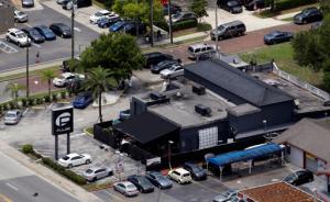 Law enforcement officials work at the scene of the Pulse Orlando nightclub following a fatal shooting Sunday, June 12, 2016, in Orlando, Fla. (AP Photo/Chris O'Meara)