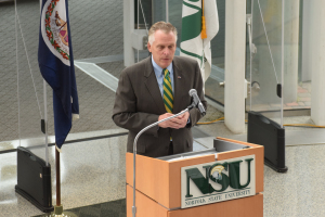 Virginia Governor Terry McAuliffe speaks in the Norfolk State University library rotunda regarding high education policy.