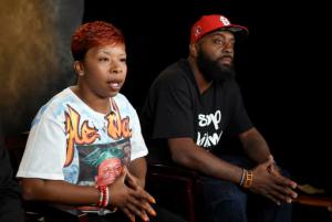 FILE - In this Sept. 27, 2014, file photo, the parents of Michael Brown, Lesley McSpadden, left, and Michael Brown, Sr., sit for an interview with The Associated Press in Washington. Defense attorneys in the wrongful-death lawsuit by Michael Brown's parents cite recent ambushes of police in Texas and Louisiana among reasons against expanding who can see sensitive grand jury details related to Brown's Ferguson 2014 death. (AP Photo/Susan Walsh, File)