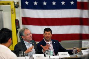Primus Aerospace owner and president Randy Brodsky listens at right  as Democratic vice presidential candidate, Sen. Tim Kaine, D-Va., speaks during a roundtable and discussion with local small business owners, hosted by Primus Aerospace, a manufacturing company, in Lakewood, Colo., Tuesday, Aug. 23, 2016. (AP Photo/Brennan Linsley)