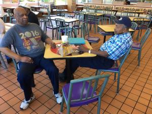 This photo taken Aug. 22, 2016 shows Ike Jenkins, right, and James Smith in East Cleveland, Ohio. Black Republicans cheer Donald Trump for a newfound rhetorical outreach to African-Americans, but say the GOP presidential nominee must take the message beyond arenas filled with white supporters and venture instead to the inner cities he has started talking about at rallies. (AP Photo/Bill Barrow)