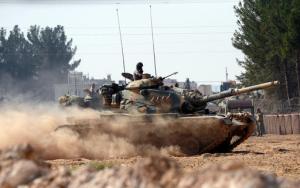 Turkish tanks head towards the Syrian border, in Karkamis, Turkey, Wednesday Aug. 31, 2016. Turkey on Wednesday dismissed reports of a cease-fire deal with Kurdish rebels in northern Syria, and vowed to continue its week-old military incursion into the neighboring country until all "terror entities are eliminated." Prime Minister Binali Yildirim said Wednesday that military "operations will continue until all terrorist elements have been neutralized, until all threats to our borders, our lands and our citizens are completely over. " (Ismail Coskun, IHA via AP)