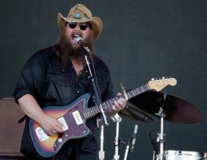 FILE - In this June 11, 2016, file photo, Chris Stapleton performs at the Bonnaroo Music and Arts Festival in Manchester, Tenn. Stapleton, Eric Church and budding newcomer Maren Morris are the leaders at the 2016 Country Music Association Awards. The three performers received five nominations each Wednesday, Aug. 31. The CMAs will air live Nov. 2 on ABC in Nashville, Tennessee, celebrating its 50th anniversary. (Photo by Wade Payne/Invision/AP, File)