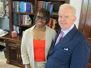 Felicia Sanders, a survivor of the shootings at Charleston's Emanuel AME Church, poses with attorney Andy Savage in Savage's office in Charleston, S.C., on Aug. 4, 2016. Savage represents Michael Slager, a white former policeman facing a murder charge in the shooting of a black motorist, as well as victims and the families of victims of the June, 2015 shootings at the church. Trials in both cases are scheduled to begin in Charleston this fall. (AP Photo/Bruce Smith)