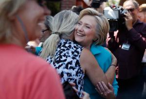 Democratic presidential candidate Hillary Clinton greets supporters outside the Hub Coffee Roasters, in Reno, Nev., Thursday, Aug. 25, 2016. (AP Photo/Carolyn Kaster)