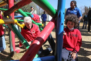 FILE - In this Aug. 8, 2015 file photo, former President Bill Clinton helps paint a jungle gym during a visit to a Clinton Foundation project in Johannesburg. As Bill Clinton’s presidency ended, he was popular, yet still tainted by scandal, and struggling to find his footing after eight years in the White House. He eventually channeled his energy into the global philanthropy that bears his name and has shaped so much of his post-presidential legacy. (AP Photo Jordi Matis, File)