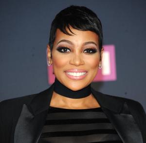 FILE - In a Monday, July 11, 2016 file photo, Monica attends the arrivals at VH1's Hip Hop Honors at David Geffen Hall at Lincoln Center, in New York. Monica says she’s happy to see her 13-year-old hit “So Gone” trend heavily on social media, spike in sales and streams and find a new audience with younger kids. The Grammy winner’s 2003 song, produced by Missy Elliott, has enjoyed a rebirth since the #SoGoneChallenge was introduced, where rappers, or anyone, spit rhymes over the track’s slick beat. (Photo by Brad Barket/Invision/AP, File)