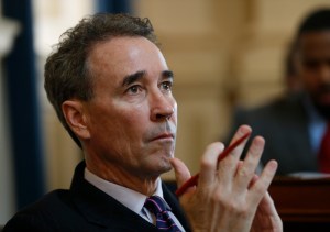 FILE- In this Jan. 20, 2015 file photo former delegate Joe Morrissey, D-Henrico, watches the proceedings during the House of Delegates session at the Capitol in Richmond, Va. A new poll shows the flamboyant former Virginia lawmaker who pleaded guilty to a misdemeanor in a sex scandal involving a 17-year-old girl, whom he later married, is the current front-runner in the race to be Richmond's next mayor. (AP Photo/Steve Helber, File)