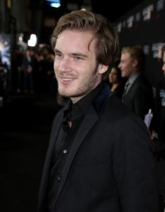 FILE - In this Oct. 28, 2013 file photo, Felix "PewDiePie" Kjellberg's arrives at the Los Angeles premiere of "Ender's Game" at TCL Chinese Theatre in Los Angeles. Kjellberg's Twitter account was briefly suspended this week and the blue check mark detonating his once-verified status was removed after the YouTube star changed his avatar. He said in a video posted Wednesday, Aug. 31, 2016, on YouTube that he purposely unverified his account "as a joke". (Photo by Matt Sayles/Invision/AP, File)