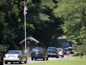 Motorcade vehicles escorting President Barack Obama and members of his family arrive at entrance to Prince William Forest Park in Va., Sunday, Aug. 28, 2016. The president and first family are planning on hiking at the national park during their visit to the area. (AP Photo/Pablo Martinez Monsivais)