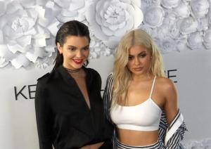 In this image taken from video, sisters Kendall Jenner, left, and and Kylie Jenner pose at a party for their KENDALL + KYLIE collection in downtown Manhattan on Wednesday, Sept 7, 2016.  Their fashion collection includes clothing, footwear and handbags. (AP Photo/Ezra Kaplan)