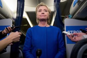 Democratic presidential candidate Hillary Clinton pauses while she gives remarks on the explosion in Manhattan's Chelsea neighborhood onboard her campaign plane at Westchester County Airport, in White Plains, N.Y., Saturday, Sept. 17, 2016. (AP Photo/Andrew Harnik)