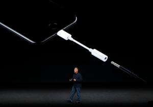 FILE - In this Sept. 7, 2016, file photo, Phil Schiller, Apple's senior vice president of worldwide marketing, talks about the features on the new iPhone 7 earphone options during an event to announce new products, in San Francisco. The new iPhones are better, even when considering that the most dramatic change is what got taken away: the traditional headphone jack. Without a traditional headphone jack, wired headphones plug into the Lightning port normally used for charging. A 3-inch-long adapter is included for your old headphones. (AP Photo/Marcio Jose Sanchez, File)