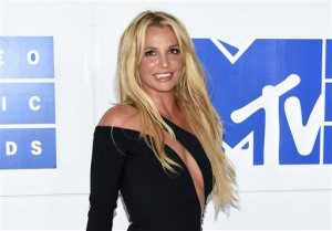 FILE - In this Aug. 28, 2016 file photo, Britney Spears arrives at the MTV Video Music Awards in New York. Los Angeles court records show Spears and her caretakers  settled a long-running libel and breach-of-contract lawsuit on Friday, Sept. 2, 2016, that was filed by her former confidante Sam Lutfi against the pop singer and her parents. (Photo by Evan Agostini/Invision/AP, File)