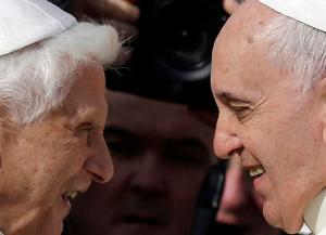 FILE - This Sept. 28, 2014 file photo shows Pope Francis, right, greeting Pope Emeritus Benedict XVI prior to the start of a meeting with elderly faithful in St. Peter's Square at the Vatican. Excerpts of a new book-interview, "The Last Conversations", by Benedict and German journalist Peter Seewald, where the retired pope offers final reflections on papacy, were published Thursday, Sept. 8, 2016 in Italy's Corriere della Sera.  (AP Photo/Gregorio Borgia, files)