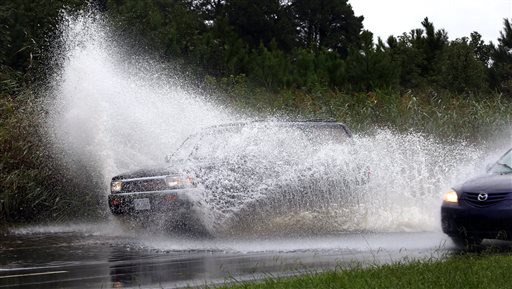 Stalled front and tropical storm deluge roads, close&nbsp;schools