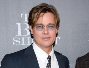 FILE - In this Nov. 23, 2015 file photo, actors Brad Pitt attends the premiere of "The Big Short" in New York.  Pitt is skipping his first public appearance after his split with Angelina Jolie. He says he won’t attend the premiere of Terrence Malick’s new documentary Wednesday night as scheduled. Pitt, who narrates “Voyage of Time,” said in a statement Wednesday, Sept. 28, 2016, that he’s grateful to have been part of the project, but is “currently focused on my family situation and don’t want to distract attention away from this extraordinary film.”(Photo by Evan Agostini/Invision/AP, File)