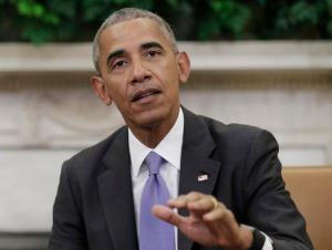 President Barack Obama talks to media at the start of a meeting with business, government, and national security leaders in the Oval Office of the White House in Washington, Friday, Sept. 16, 2016, to discuss how the Trans-Pacific Partnership can benefit American workers and businesses and further national security. (AP Photo/Carolyn Kaster)