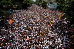 Demonstrators take part in the  "taking of Caracas" march in Caracas, Venezuela, Sept 1, 2016. Venezuela's opposition is vowing to keep up pressure on President Nicolas Maduro after flooding the streets of Caracas with demonstrators Thursday in its biggest show of force in years. Protesters filled dozens of city blocks in what was dubbed the "taking of Caracas" to pressure electoral authorities to allow a recall referendum against Maduro this year. (AP Photo/Ariana Cubillos)