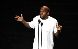 File-This Aug. 28, 2016, file photo shows Kanye West appearing at the MTV Video Music Awards at Madison Square Garden in New York. West brought his “Saint Pablo Tour” to the small stage at a New York Fashion Week party, where he performed Friday, Sept. 9, 2016, under smoky, dark lights, and ended his set with some outspoken words, per usual.  (Photo by Chris Pizzello/Invision/AP, File)