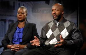 FILE - In this April 11, 2012 file photo, Sybrina Fulton, left, and Tracy Martin, parents of Trayvon Martin, appear during an interview in Washington. Spiegel & Grau announced Wednesday, Sept. 28, 2016, that it will release “Rest in Power: The Enduring Life of Trayvon Martin, by Sybrina Fulton and Tracy Martin.  Trayvon Martin was fatally shot in 2012 by a neighborhood watch volunteer. The book will be released in January. (AP Photo/Susan Walsh, File)