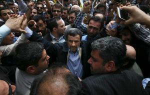 In this picture taken on Friday, July 1, 2016, former Iranian President Mahmoud Ahmadinejad, center, is greeted by well wishers while attending an annual pro-Palestinian rally marking Al-Quds (Jerusalem) Day at the Enqelab-e-Eslami (Islamic Revolution) St. in Tehran, Iran. Close allies of former President Mahmoud Ahmadinejad say Iran's supreme leader has recommended he not run in next May's presidential election because he is a polarizing figure among hard-liners. (AP Photo/Vahid Salemi)
