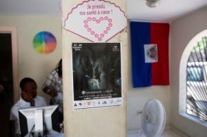 A Massimadi festival poster hangs at the Kouraj organization office in Port-au-Prince, Haiti, Tuesday Sept. 27, 2016.  The four-day Massimadi film, art and performance event was supposed to start Tuesday but organizers of the cultural festival celebrating Haiti’s Afro-Caribbean LGBTQ community say it has been called off due to threats of violence. (AP Photo/Dieu Nalio Chery)