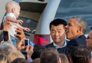 While greeting well wishers after arriving at John F. Kennedy International Airport in New York, President Barack Obama reaches out to Desmond Hatfield-Rudin, eight months old, of the Brooklyn borough of New York, Sunday, Sept. 18, 2016, in New York. (AP Photo/Craig Ruttle)