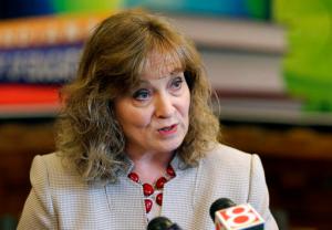 FILE - In this April 30, 2015, file photo, Indiana Superintendent of Public Instruction Glenda Ritz speaks at a news conference in Indianapolis. New details about a lucrative, no-bid contract are raising questions about how Ritz manages her state agency at a time she's running for re-election. The contract, engineered by a Ritz aide shortly before he left to work for the vendor, was not put out to bid or vetted by the state agency responsible for viewing big-dollar contracts, but instead was signed off by the Democrat Ritz's chief of staff as others raised red flags. (AP Photo/Michael Conroy, File)