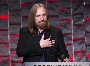FILE - In this June 9, 2016 file photo, Tom Petty attends the 47th Annual Songwriters Hall of Fame Induction Ceremony and Awards Gala in New York. Petty will be honored as the MusiCares Person of the Year next year days before the Grammy Awards. The Recording Academy announced Wednesday, Sept. 28, that Petty will receive the prestigious honor in Los Angeles on Feb. 10, 2017. (Photo by Charles Sykes/Invision/AP, File)