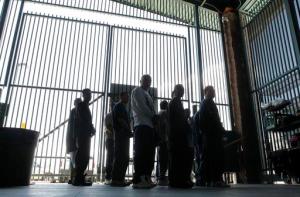 FILE - In this Aug. 9, 2012, file photo, people are detained for being in the country illegally and are transferred out of the holding area after being processed at the Tucson Sector of the U.S. Customs and Border Protection headquarters in Tucson, Ariz. The number of immigrants in the U.S. illegally has changed little since the Great Recession began, dropping to 11.1 million in 2014 from 11.2 million in 2012 and 11.3 million in 2009, according to a study released Tuesday, Sept. 20, 2016, by the Pew Research Center. (AP Photo/Ross D. Franklin, File)