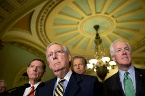 FILE - In tis June 21,2016 file photo, Senate Majority Leader Mitch McConnell of Ky., accompanied by, from left, Sen. John Barrasso, R-Wyo., Sen. John Thune, R-S.D., and Senate Majority Whip John Cornyn of Texas, listen to a question during a news conference on Capitol Hill in Washington. Democrats are criticizing the latest Republican version of legislation that's needed to avoid a government shutdown next weekend. Sen. Harry Reid of Nevada told reporters that McConnell will unveil the stopgap spending bill and a long-delayed bill to combat the Zika virus on Thursday, Sept, 22, 2016, but that Democrats haven't signed on to the measure. House Minority Leader Nancy Pelosi said Democrats in that chamber won't back the measure, either.  (AP Photo/Alex Brandon, File)