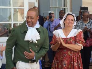 In this photo taken June 25, 2016, Craig Syphax, of Arlington, Va. and Donna Kunkel of Los Angeles, portray their ancestors at a re-enactment of the 1821 wedding of slaves Charles Syphax and Maria Carter at Arlington House, the estate once owned by George Washington's adopted son, George Washington Parke Custis, in Arlington, Va. The re-enactment included an acknowledgement by the National Park Service that Carter was the daughter of Custis and a Mount Vernon slave, Arianna Carter. (AP Photo/Matthew Barakat)