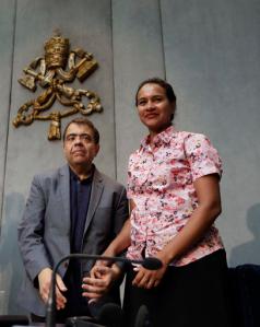 Marcilio Andrino, left, and his wife Fernanda Nascimento Rocha pose for photographers at the end of a press conference at the Vatican, Friday, Sept. 2, 2016. Andrino's cure of a viral brain infection, declared a miracle by Pope Francis earlier this year, was the final step needed to declare Mother Teresa a saint. (AP Photo/Alessandra Tarantino)