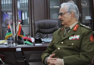 FILE -- In this March 18, 2015 file photo, Gen. Khalifa Hifter speaks during an interview with The Associated Press in al-Marj, Libya. Hifter, a powerful Libyan general whose forces recently captured several key oil facilities has rejected a U.N.-brokered government and said the country would be better served by a leader with “high-level military experience.” In a series of written responses to questions from The Associated Press this week, Hifter said his army only recognizes the authority of the Libyan parliament based in the east, which has also rejected the U.N.-backed government in the capital, Tripoli. (AP Photo/Mohammed El-Sheikhy, File)