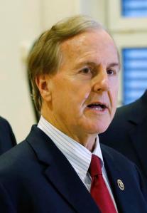 In this Monday Jan. 18, 2016 file photo, U.S. Rep. Robert Pittenger, speaks to the media at the Landstuhl Regional Medical Center in Landstuhl, Germany. Pittenger, a Republican congressman who represents the Charlotte area said Thursday that people are protesting in the city because they "hate white people."  (AP Photo/Michael Probst, File)