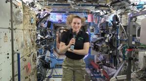 In this image from video made available by NASA, U.S. astronaut Kate Rubins speaks aboard the International Space Station during an interview on Thursday, Sept. 22, 2016. Rubins said that she doesn’t know yet whether she’ll return to Earth in late October as planned. The Russians have delayed the next crew launch for technical reasons. (NASA via AP)