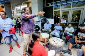 Sam Grant of the Omaha tribe addresses members of the Ponca, Santee, Winnebago and Omaha Tribes in Nebraska and Iowa along with others during a rally on Thursday, Sept. 8, 2016, in front of the Army Corps of Engineers offices in Omaha, Neb., to protest against the Dakota Access Pipeline in the Dakotas and Iowa. A judge is expected to rule Friday on whether to block construction of the pipeline that is supposed to pass close to the tribal reservation near the North Dakota-South Dakota border.  (AP Photo/Nati Harnik)