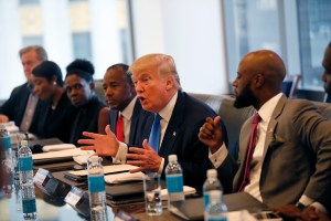 FILE - In this Aug. 25, 2016 file photo, Republican presidential candidate Donald Trump holds a roundtable meeting with the Republican Leadership Initiative in his offices at Trump Tower in New York. Dr. Ben Carson is seated next to Trump at center. In the decades since the Voting Rights Act of 1965 widely enfranchised African-Americans, they have become a reliable Democratic bloc. President Barack Obama, the nation’s first black president, won at least 95 percent and 93 percent of the black vote in his two victories, sending Republican to historical lows among African-Americans, according to exit polls. (AP Photo/Gerald Herbert, File)