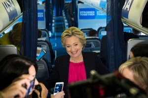 Democratic presidential candidate Hillary Clinton speaks with members of the media on board her campaign plane at Westchester County Airport in White Plains, N.Y., Tuesday, Sept. 27, 2016. (AP Photo/Matt Rourke)